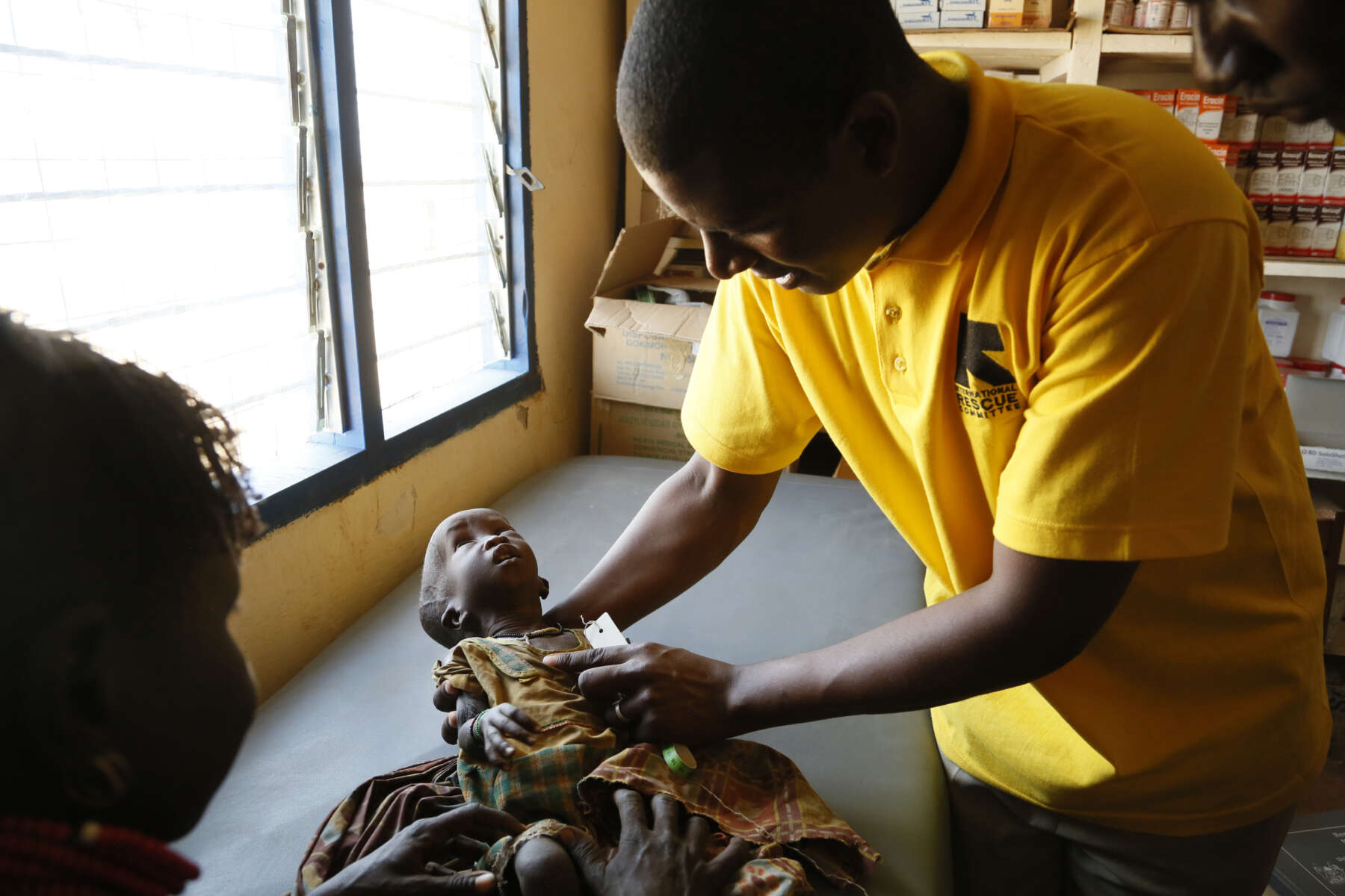 A young baby girl is assessed for signs of malnutrition by International Rescue Committee staff at a health clinic in Kapua, Turkana County, northwest Kenya